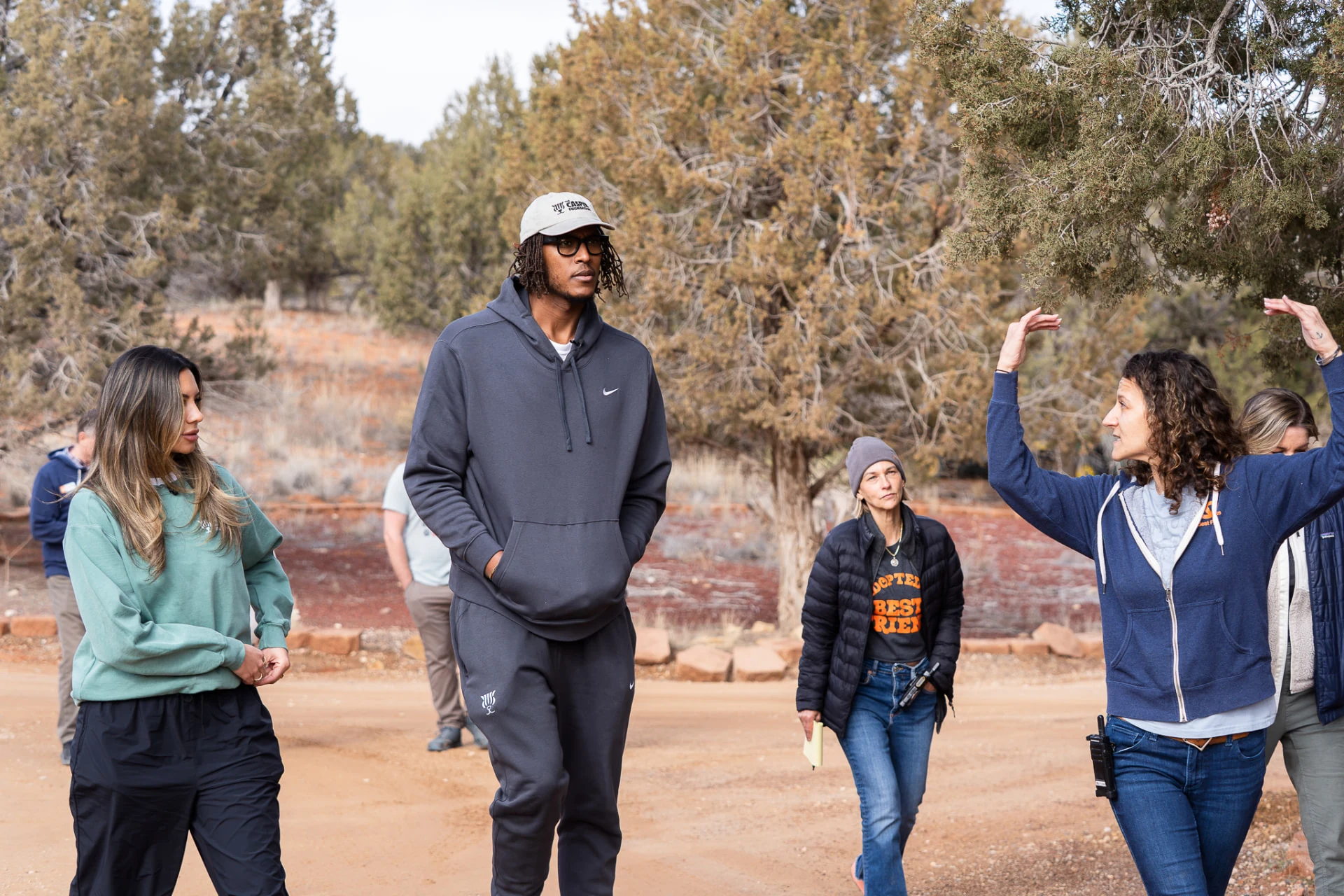Volunteers walking with rescue animals at a sanctuary