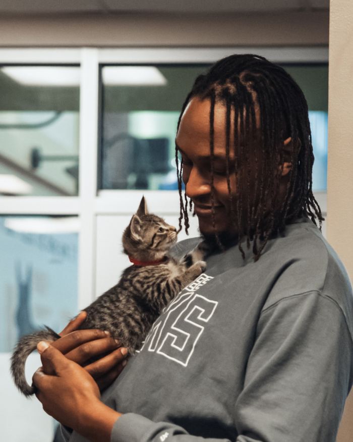 Myles Turner holding a cat